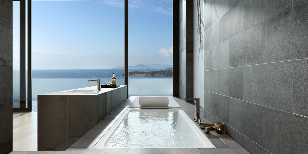 Luxurious minimalist bathroom with ocean view through large windows in Bodrum, Turkey, ideal for relaxation and design inspiration.